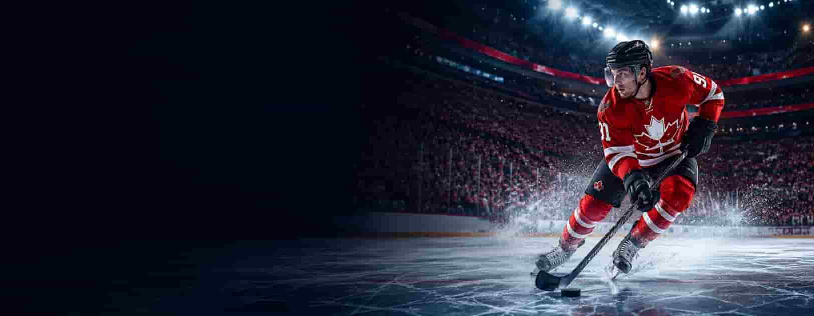 Canadian hockey player skating in a dark arena, used as the hero image for a beginner bankroll management guide.
